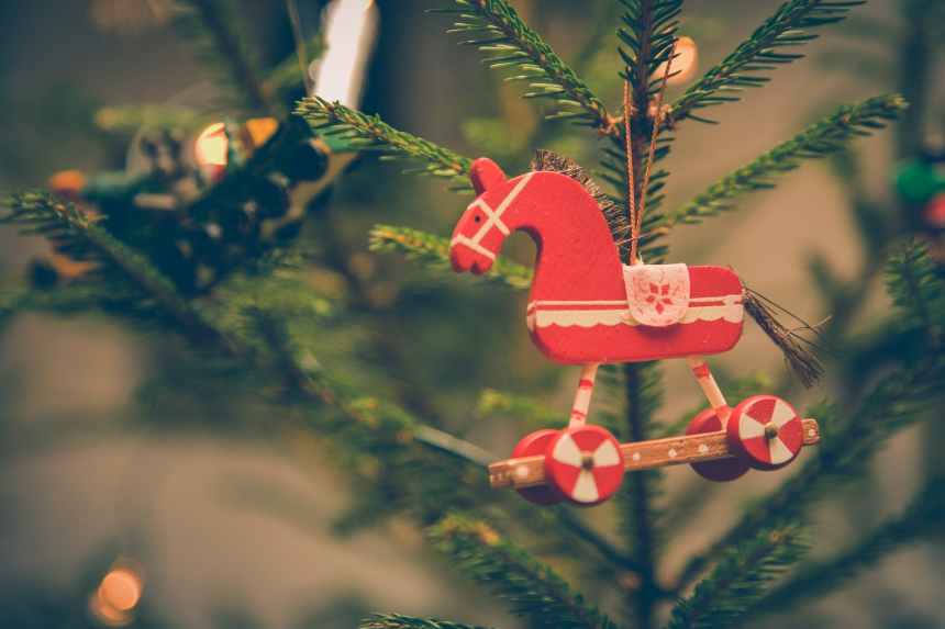 brown and red horse decor hanged on christmas tree